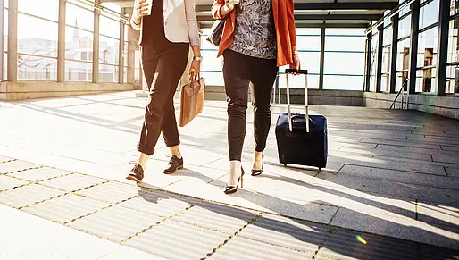 central-location-oesterreich-ladies-with-trolleys-at-the-airport