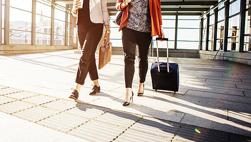 central-location-oesterreich-ladies-with-trolleys-at-the-airport